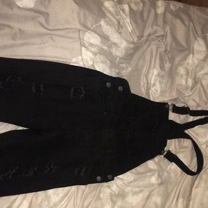 All black distressed jean overalls